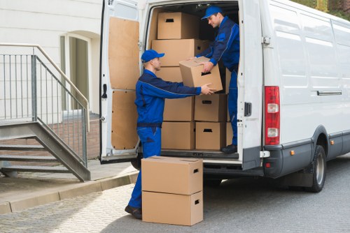 Professional movers loading household items carefully