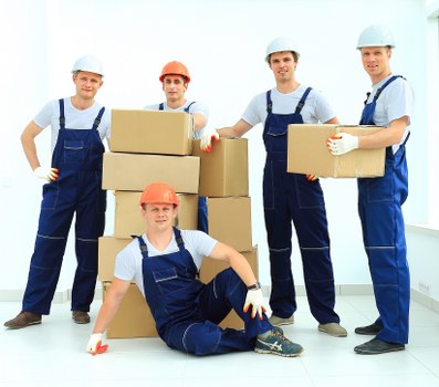 Loading furniture into a moving truck near Denmarkhill homes