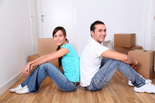 Professional movers loading boxes and household items